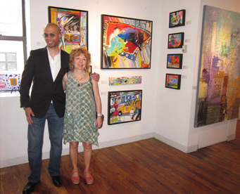 Peter Horton and Stacie Flint standing in front of Stacie's work at the opening reception of Antidote: a Contemporary Art Show curated by Basha Maryanska at the New Centrury Artists Gallery, NYC