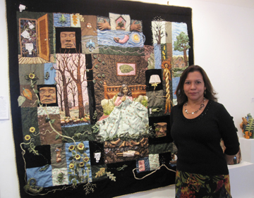 Marlene Ferrell Parillo in front of her wall hanging Dream City at  the Flat Iron Gallery, Peekskill, NY  