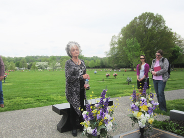 Joanne Cash Yates at the gravesite of Johnny Cash  and June Carter Cash